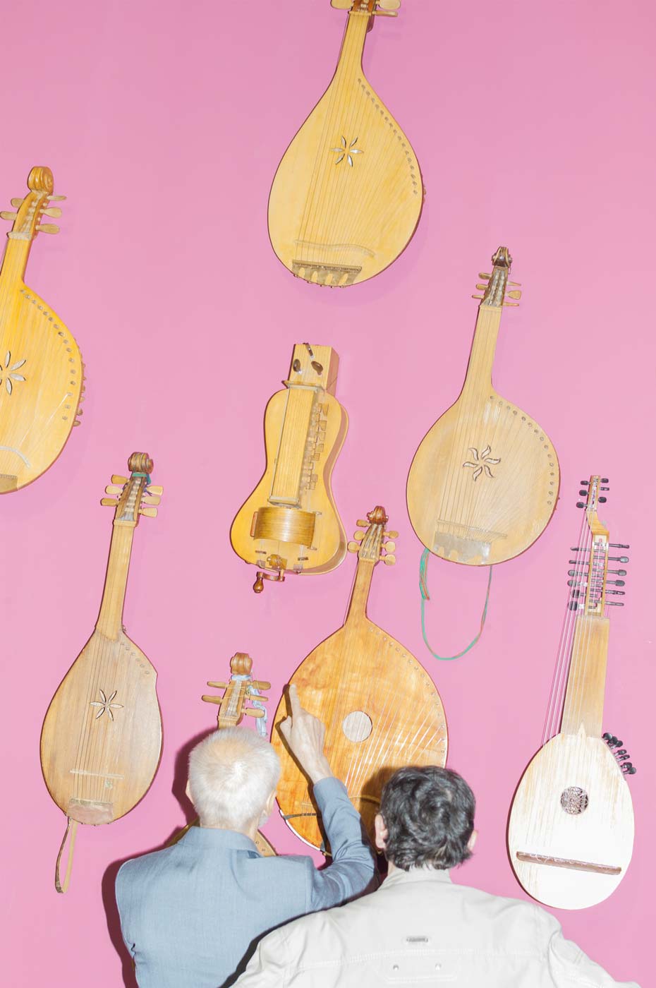 National musical instruments hanging on the pink wall